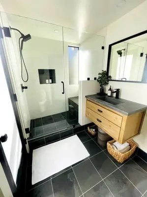 a bathroom with a shower and a sink and a mirror at Sled-Ski Snow Summit Lakeside Village - Spa - BBQ - Firepit - Loft - Games in Big Bear Lake