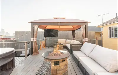 a patio with a couch and a gazebo at Gorgeous DTLA w/ View + Hot Tub! in Los Angeles