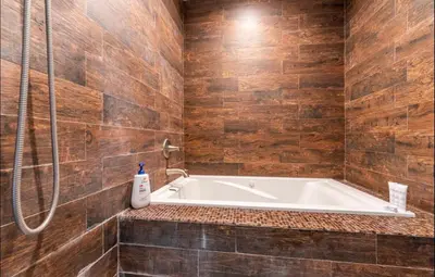 a bathroom with a bath tub and a shower at Gorgeous DTLA w/ View + Hot Tub! in Los Angeles