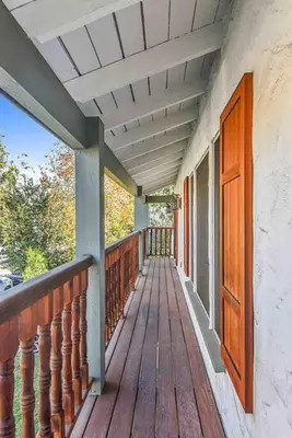 a porch of a house with a wooden deck at The Spanish Hideaway in Los Angeles