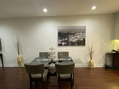 a dining room with a table and chairs at Glendale Americana 2 Bedroom 2 Bathroom Condo in Glendale