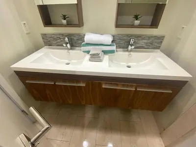 a bathroom with two sinks and two mirrors at Glendale Americana 2 Bedroom 2 Bathroom Condo in Glendale