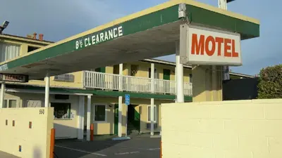 a motel sign in front of a motel at City Center Motel - Oxnard in Oxnard
