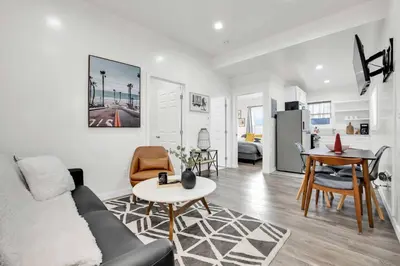 a living room with a couch and a table at Magnolia Apt in Los Angeles