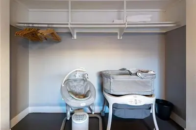 a room with a high chair and a high table at Modern San Pedro Home, Sleeps 12, Hot Tub, Fire Place, Private Parking in San Pedro