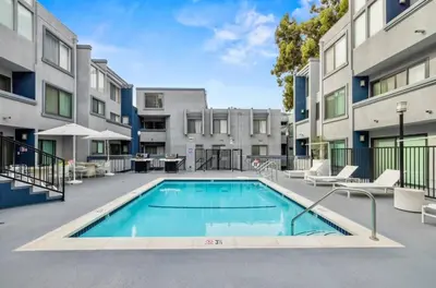 an image of a swimming pool at a apartment complex at Elegant Hollywood Retreat - Spacious 2BR 2BA Condo with Resort-Style Amenities in Los Angeles