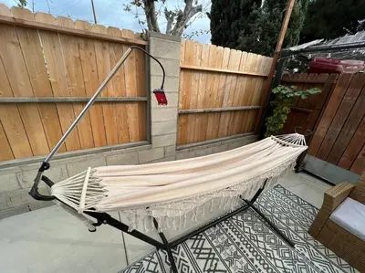 a hammock in a backyard with a fence at La Casita de Whittier, Private Unit w/patio area, Disney, Biola, Knotts in Whittier
