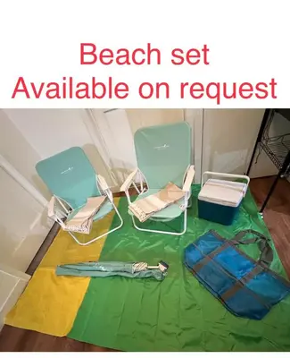 a room with two chairs and a table with a green sheet at La Casita de Whittier, Private Unit w/patio area, Disney, Biola, Knotts in Whittier