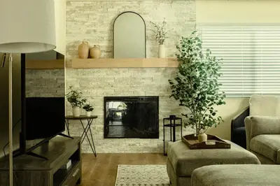 a living room with a fireplace and a tv at Cozy Family Home - 20 Mins from Disneyland in Placentia