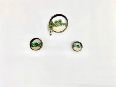 a group of three mirrors on a white wall at Malibu Secluded Escape Ocean View Zen House in Malibu