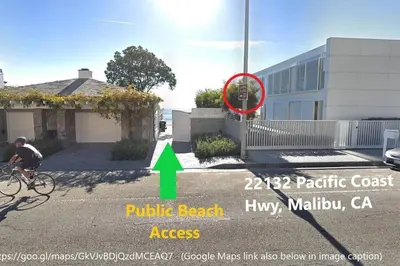 a person riding a bike in front of a house at Malibu Glass House: Architectural w 180deg Views in Malibu