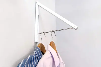 a rack of clothes hanging on a wall at Bright European Loft In Venice Beach in Los Angeles