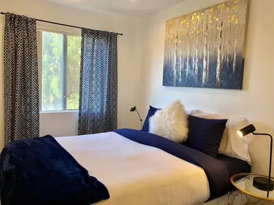 a bedroom with a large bed and a window at Silverlake and Echo Park - 6min to Downtown and Hollywood - in Los Angeles