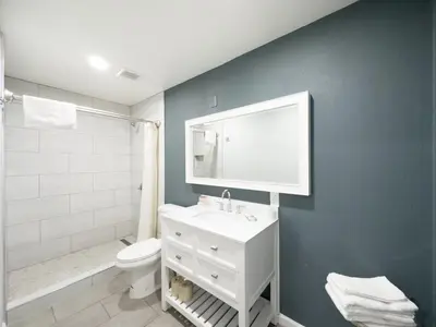 a bathroom with a white sink and a toilet at Rosemead Motel in Rosemead