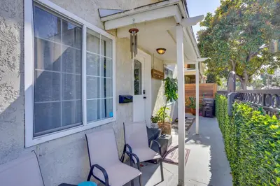 a porch with chairs and a window on a house at Super Walkable! Historic Home in Dtwn Long Beach in Long Beach
