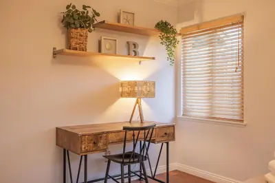 a home office with a desk and two stools at #Marbella Lane - Charming 4BR Bungalo for Relaxing Retreat in Fullerton