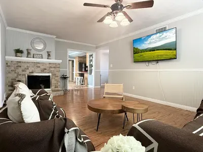 a living room with a couch and a table at #Marbella Lane - Charming 4BR Bungalo for Relaxing Retreat in Fullerton