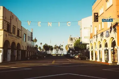 a street with a traffic light in a city at Elegant White Cottage, Venice Beach, California in Los Angeles