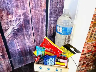 a pile of junk food and a bottle of water at Garden Suite - 10 mins to Beach and LAX in Gardena