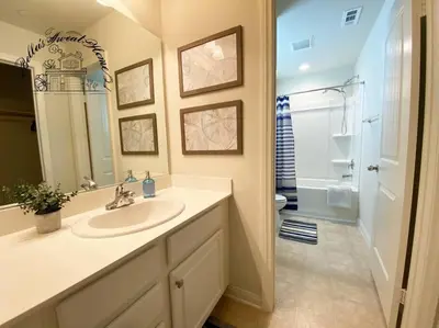 a bathroom with a sink and a shower and a toilet at Bella's sweet house 11155 in Mira Loma
