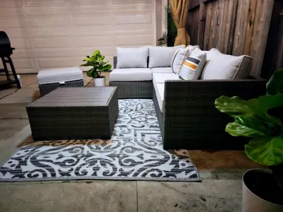 a living room with a couch and a rug at The Heart Of LA House in Los Angeles