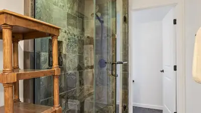 a shower with a glass door in a bathroom at Honeypot by AvantStay Indoor Pool Hot Tub in Big Bear Lake