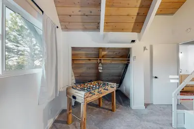 a room with a wooden table in a room at Saint Bernard Beauty in Lake Arrowhead