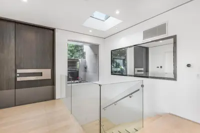 a bathroom with a sink and a mirror at Sunset Heights in Los Angeles