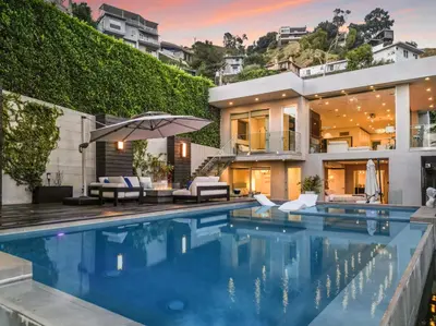 a villa with a swimming pool and a house at Sunset Heights in Los Angeles