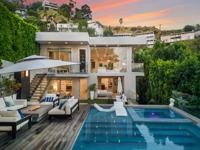 a villa with a swimming pool and a house at Sunset Heights in Los Angeles
