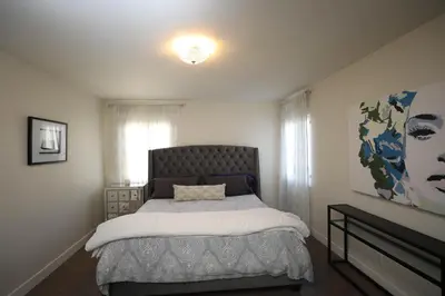 a bedroom with a large bed in a room at Gorgeous Renovated 3BD 2BA near West Hollywood and Beverly Hills in Los Angeles