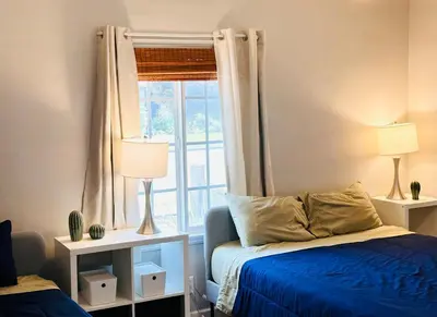a bedroom with a bed and a window at Los Angeles Home Located in Beautiful Pasadena in Pasadena