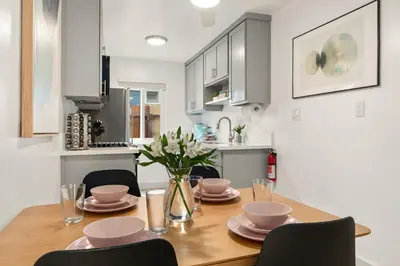 a kitchen and dining room with a table and chairs at Central Apartment in a Hip Walkable Neighborhood NRP23-01143 in Long Beach