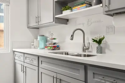 a kitchen with white cabinets and a sink at Central Apartment in a Hip Walkable Neighborhood NRP23-01143 in Long Beach