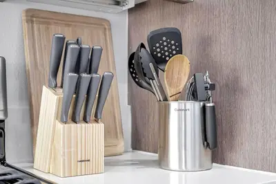 a kitchen counter with a container of knives and utensils at 5 Heart of Santa Monica apartment in Los Angeles