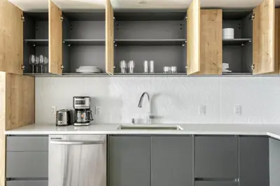 a kitchen with white cabinets and a sink at Downtown 1BR w Pool Gym WD nr Staples Center LAX-551 in Los Angeles