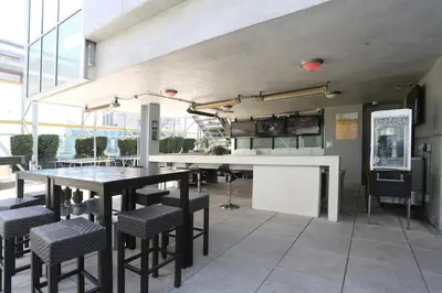 a dining room with a table and some chairs at Downtown 1BR w Pool Gym WD nr Staples Center LAX-551 in Los Angeles