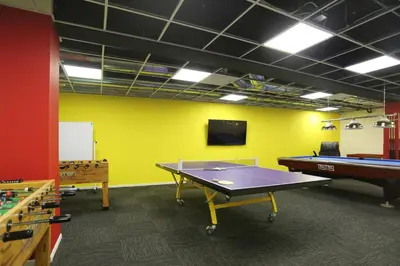 a room with a ping pong table and a tv at Downtown 1BR w Pool Gym WD nr Staples Center LAX-551 in Los Angeles