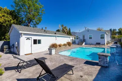 a backyard with a swimming pool and a house at San Fernando Pool home + Large Private Guest House in San Fernando