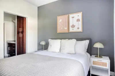 a bedroom with a white bed and two lamps at Hollywood 1BR w Gym Pool Spa nr Sunset LAX-55 in Los Angeles