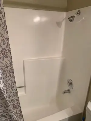 a bathroom with a shower with a white tub at Hollywood loft spectacular free parking in Los Angeles