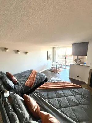 a bedroom with a bed and a couch at Amazing Universal Studios Loft FREE parking in Los Angeles