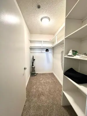 a room with a hallway with white walls at Amazing Universal Studios Loft FREE parking in Los Angeles