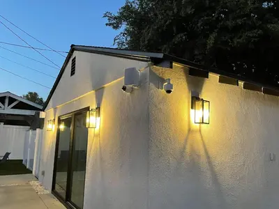 a white building with lights on the side of it at Gated private house with own parking Sherman Oaks in Los Angeles