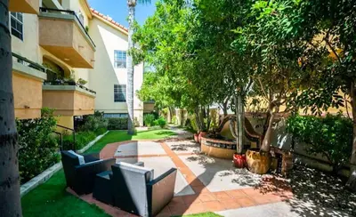 a patio with couches in a yard next to a building at W Hollywood 1BR nr Shops Melrose LAX-210 in Los Angeles