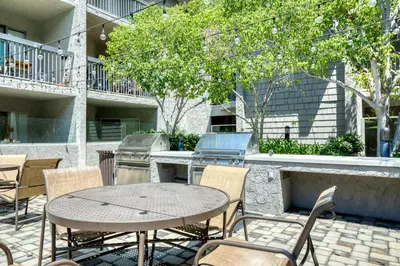 a patio with a table and chairs and a grill at Pasadena 1BR w Gym Pool nr Colorado Ave LAX-862 in Pasadena