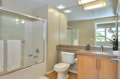 a bathroom with a toilet and a sink and a shower at Awesome Top Floor 2-Bedroom with Balcony in Los Angeles