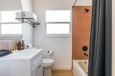 a bathroom with a sink and a toilet and a shower at Cozy Sunny Brand-new Apt 1 Block From The Beach in Long Beach