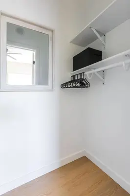a white room with a mirror and a window at Cozy Sunny Brand-new Apt 1 Block From The Beach in Long Beach