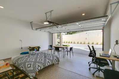 a bedroom with a bed and a table and chairs at Pet-Friendly Paramount Home, 16 Mi to Los Angeles! in Paramount